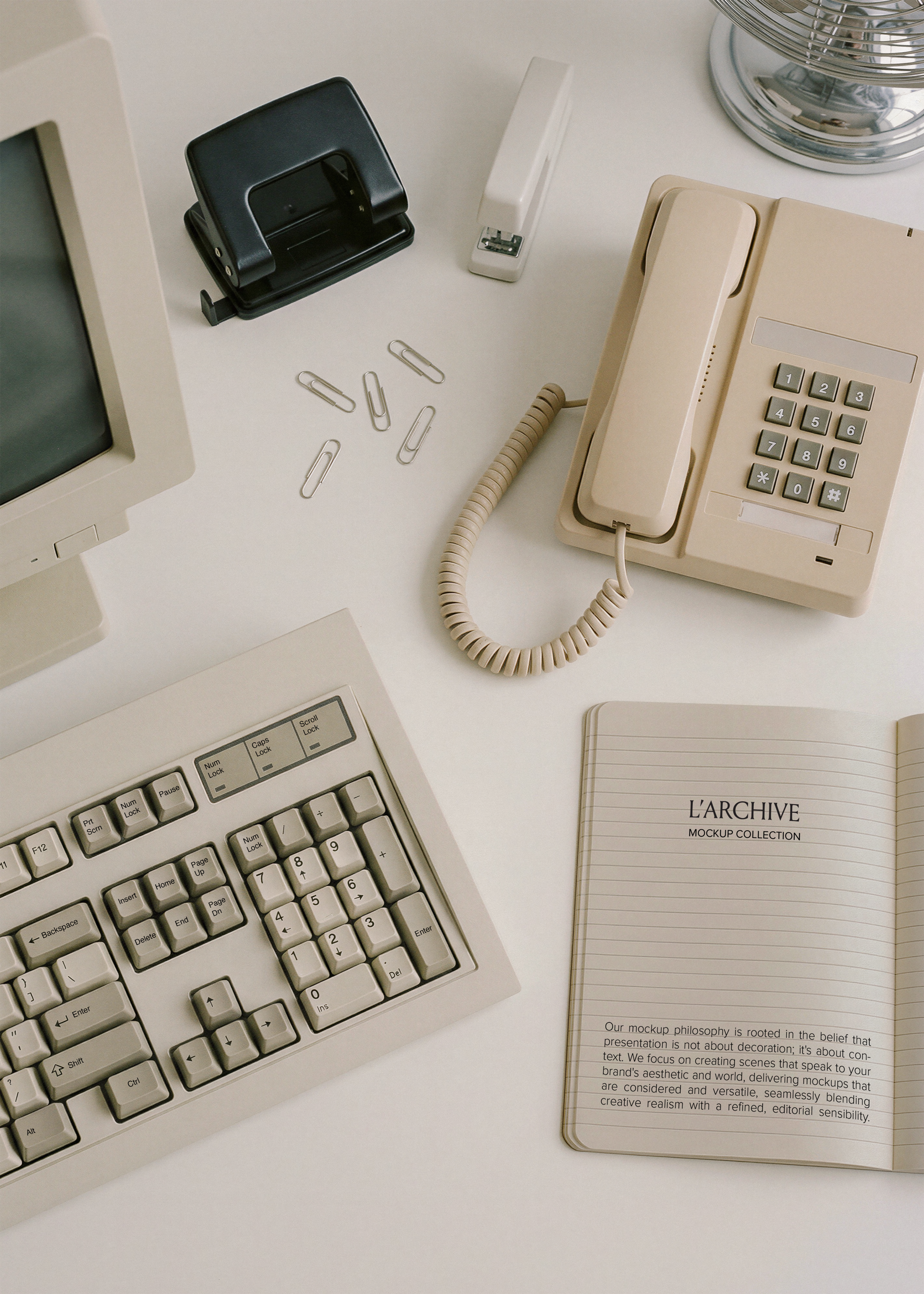 Open lined notebook stationery mockup on pale desk with vintage CRT monitor, beige keyboard, cream phone and hole punch