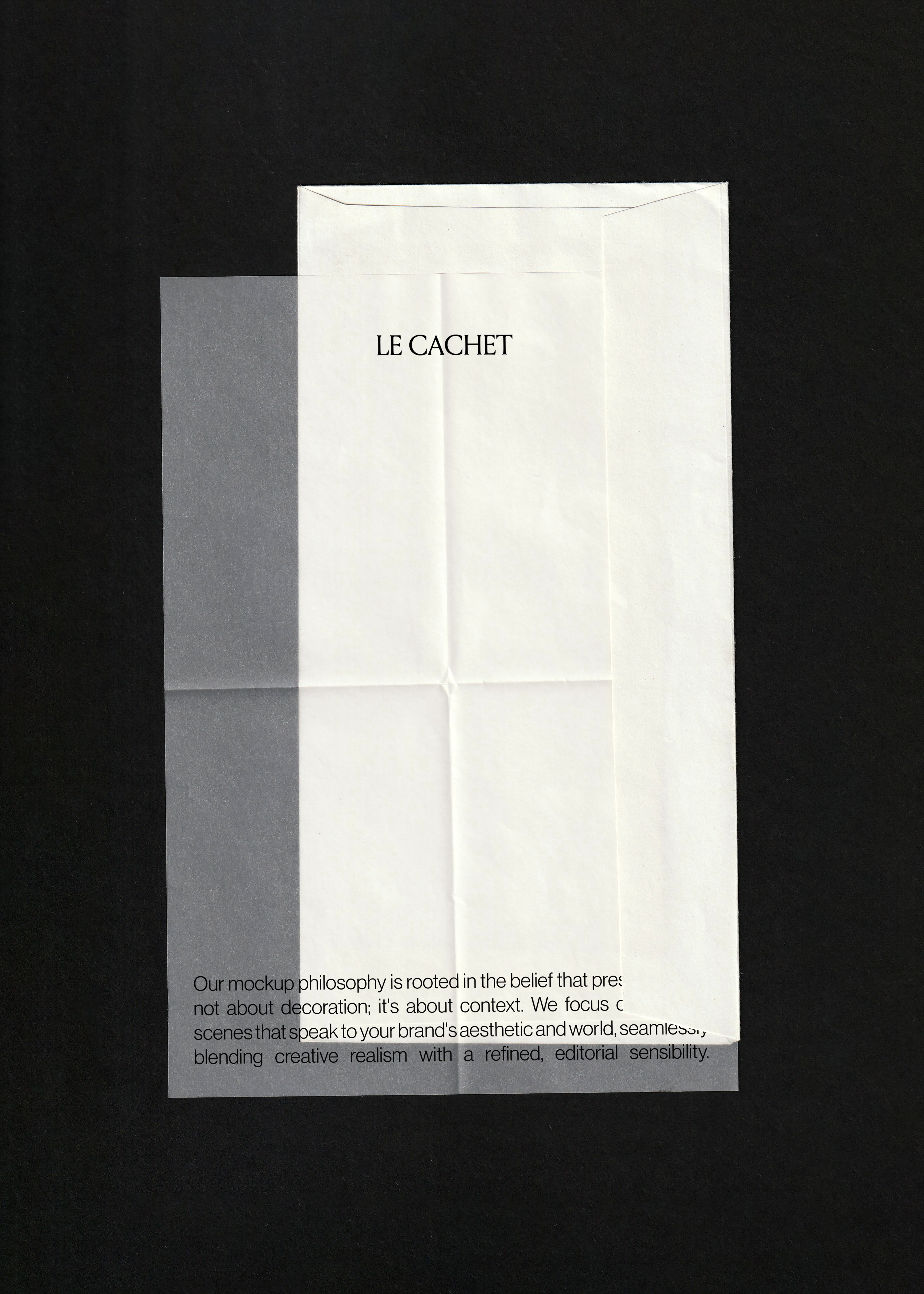 Envelope and vellum paper mockup on black, folded white envelope with a translucent vellum sheet over it