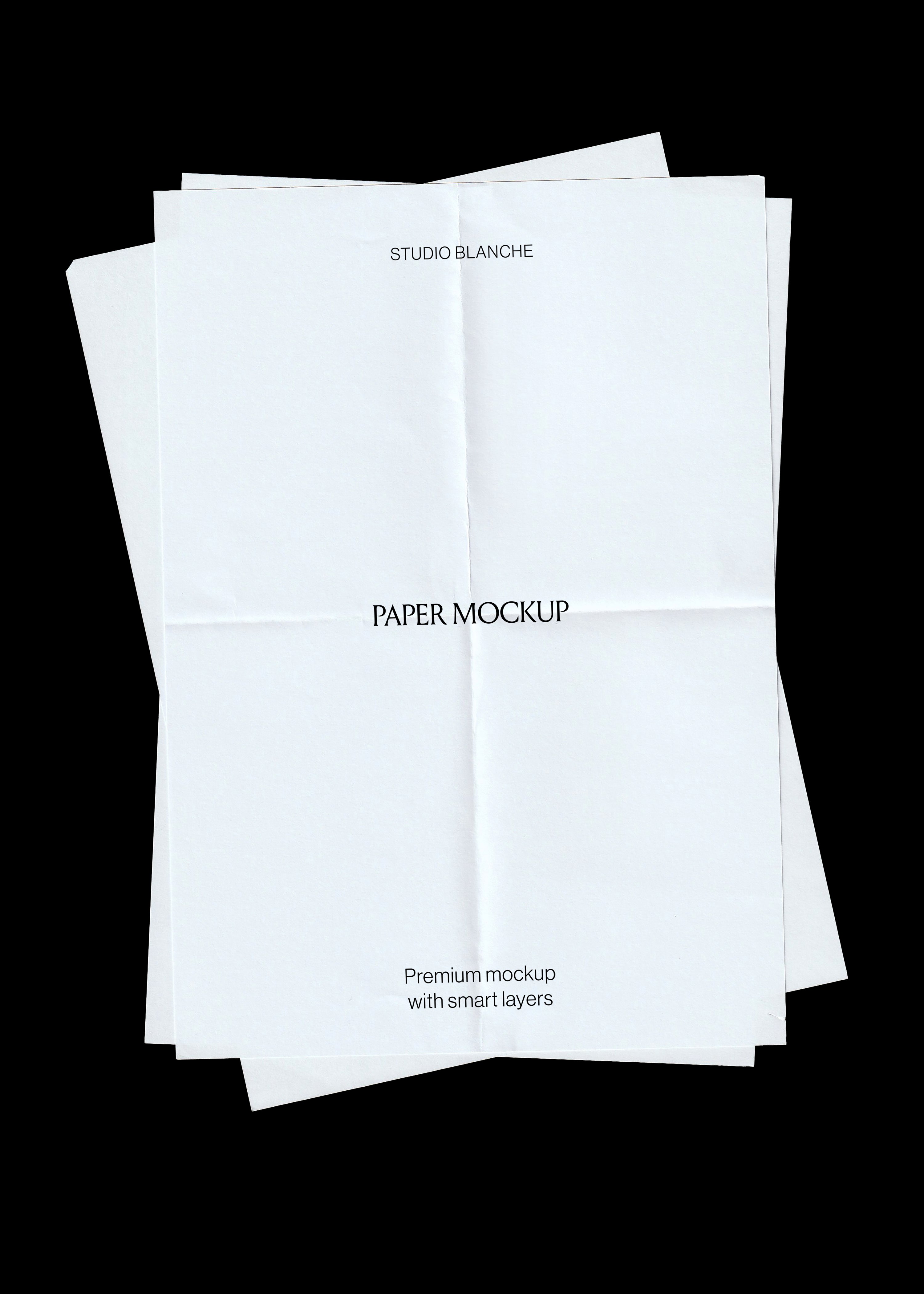Scanned paper mockup, three blank white sheets with fold creases stacked at angles on black background