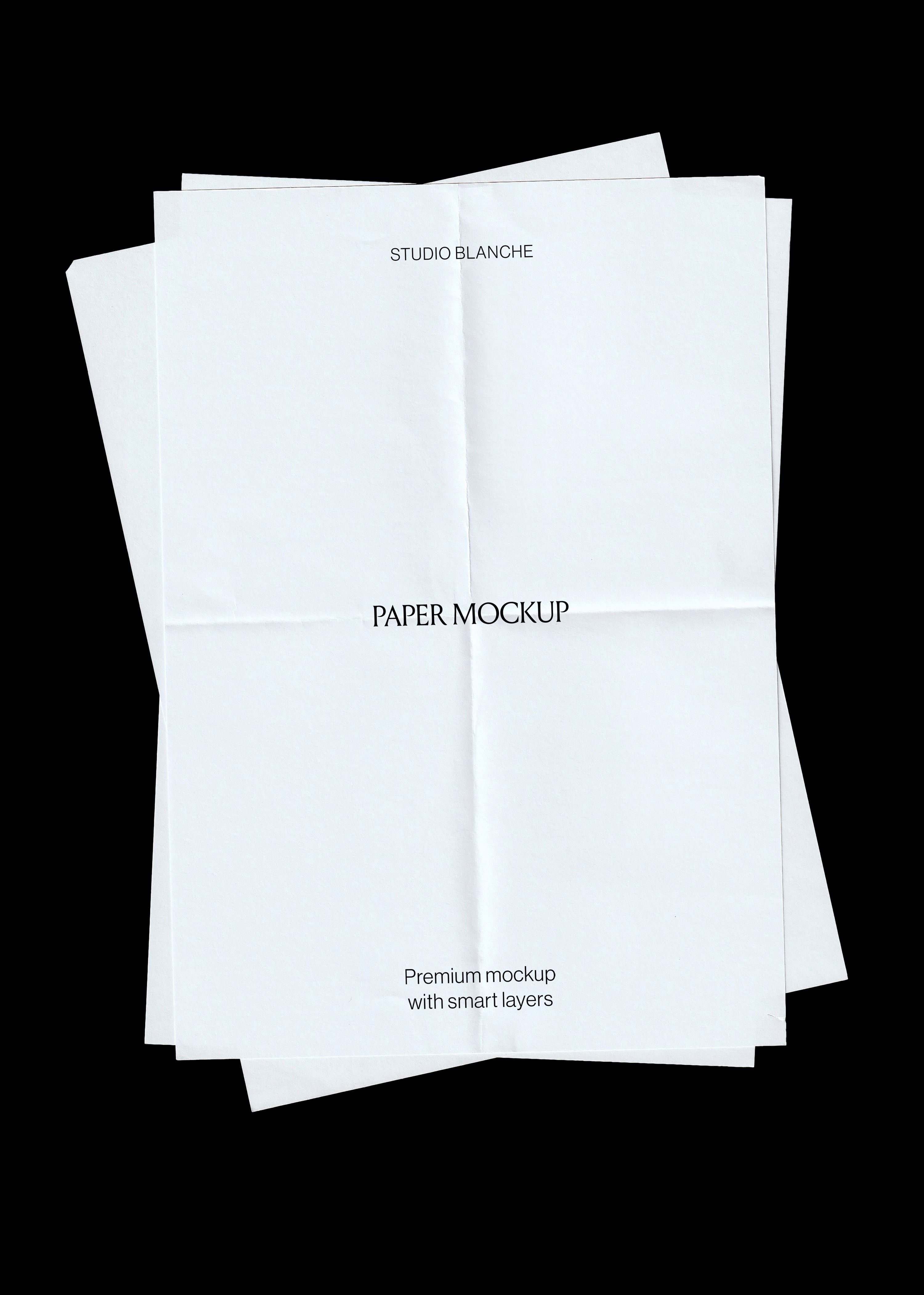 Scanned paper mockup, three blank white sheets with fold creases stacked at angles on black background