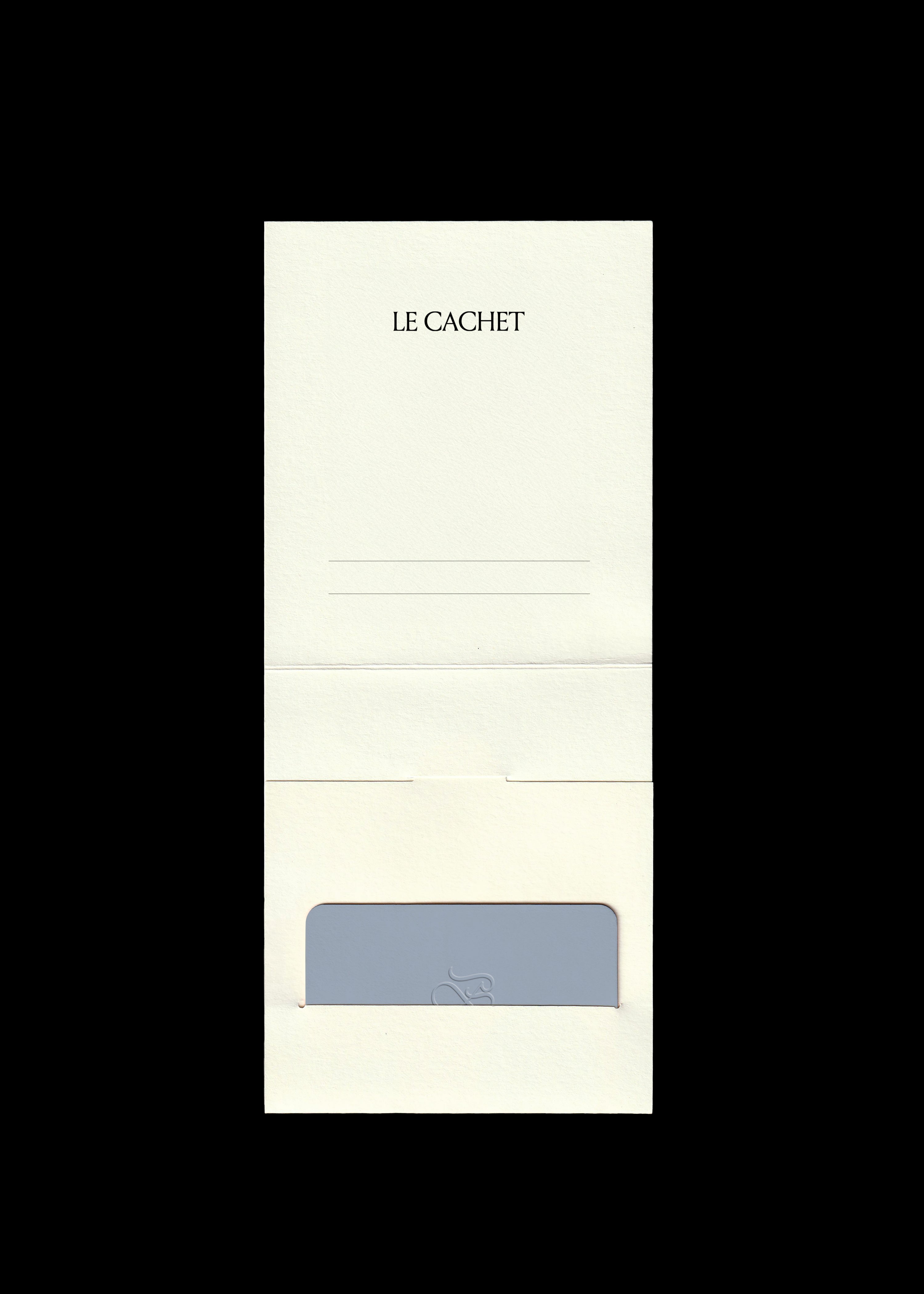 Gift card mockup in dusty blue with embossed monogram set into a cream folded card holder, black background