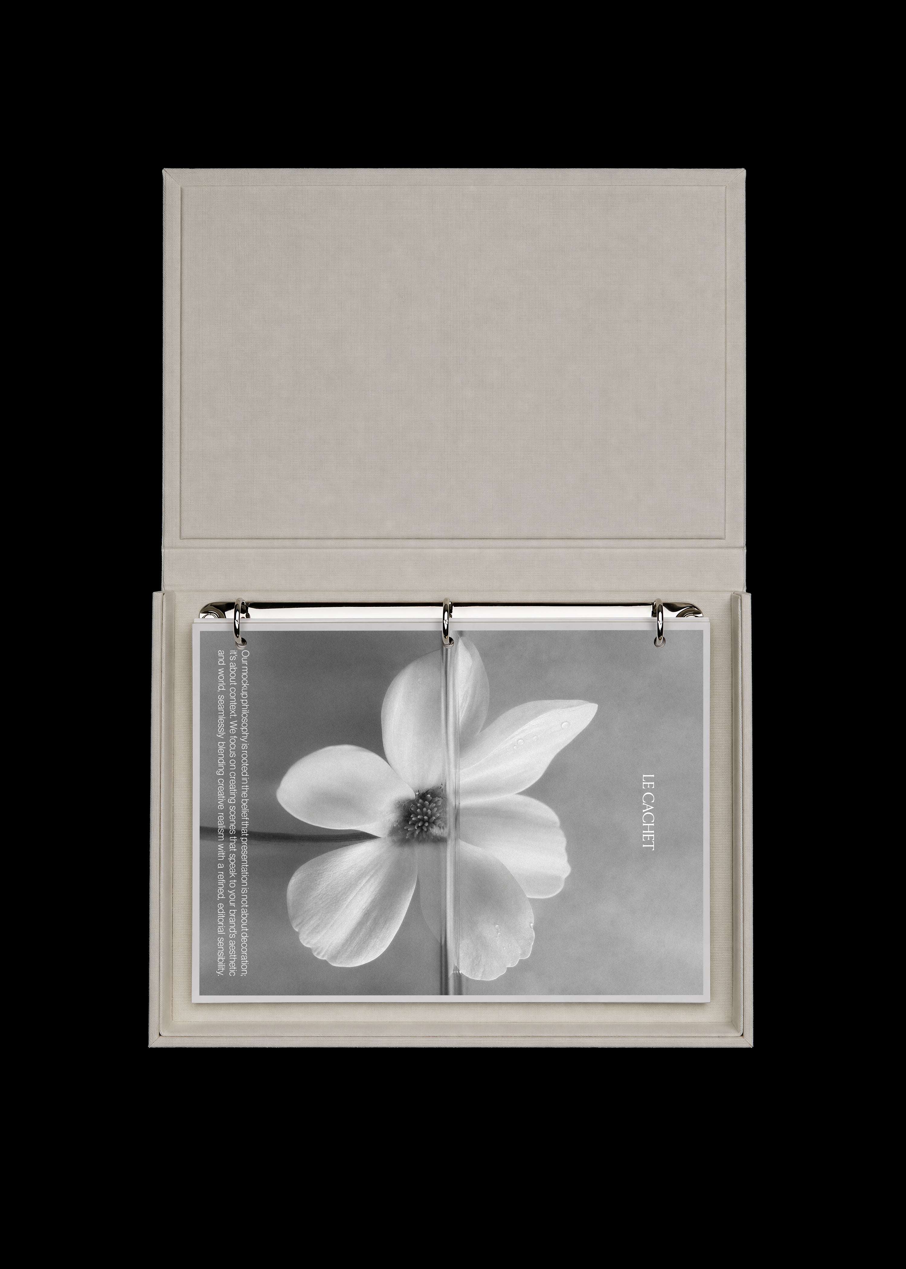 Binder and card mockup with open oatmeal linen lid, chrome rings and rotated black and white flower print card