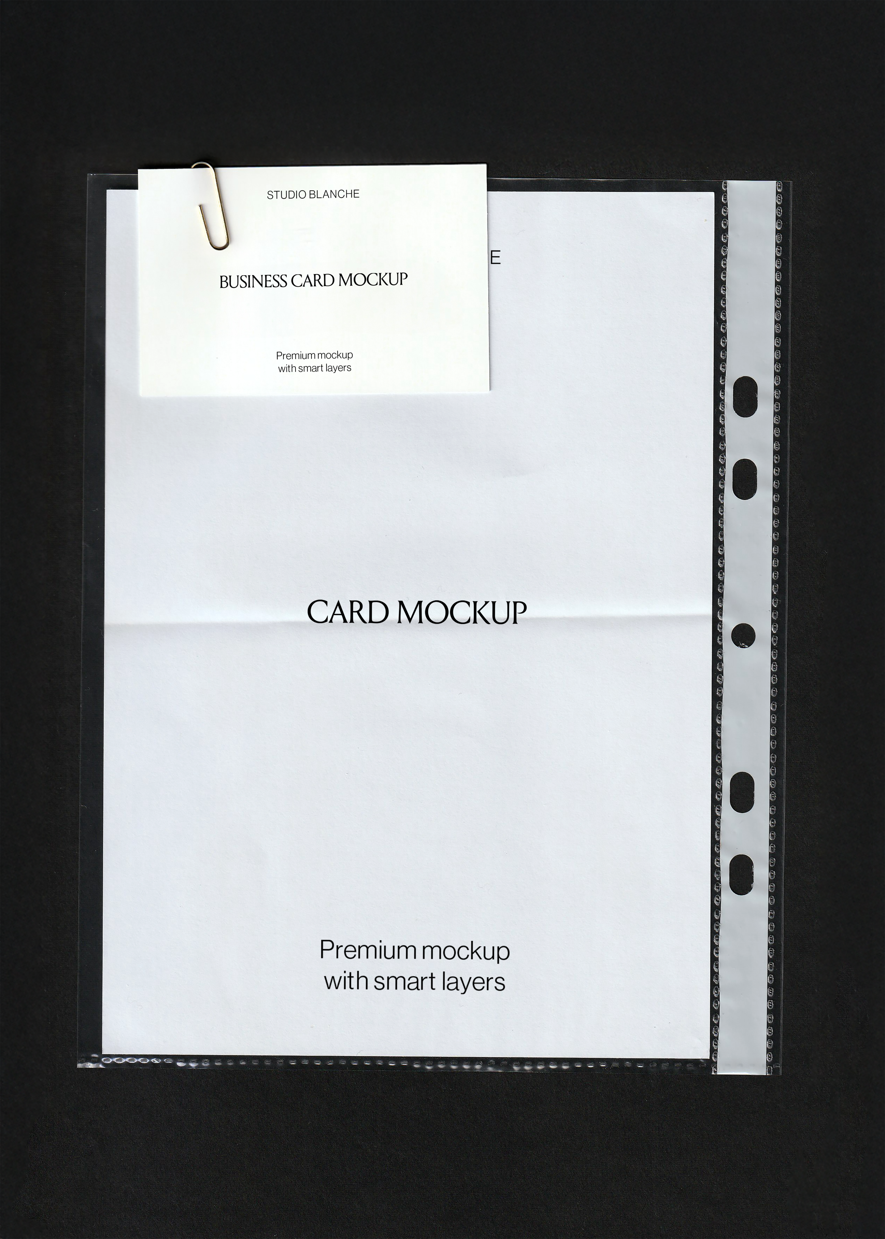 Business card mockup with gold paperclip resting on a blank A4 sheet inside a clear document sleeve, black background