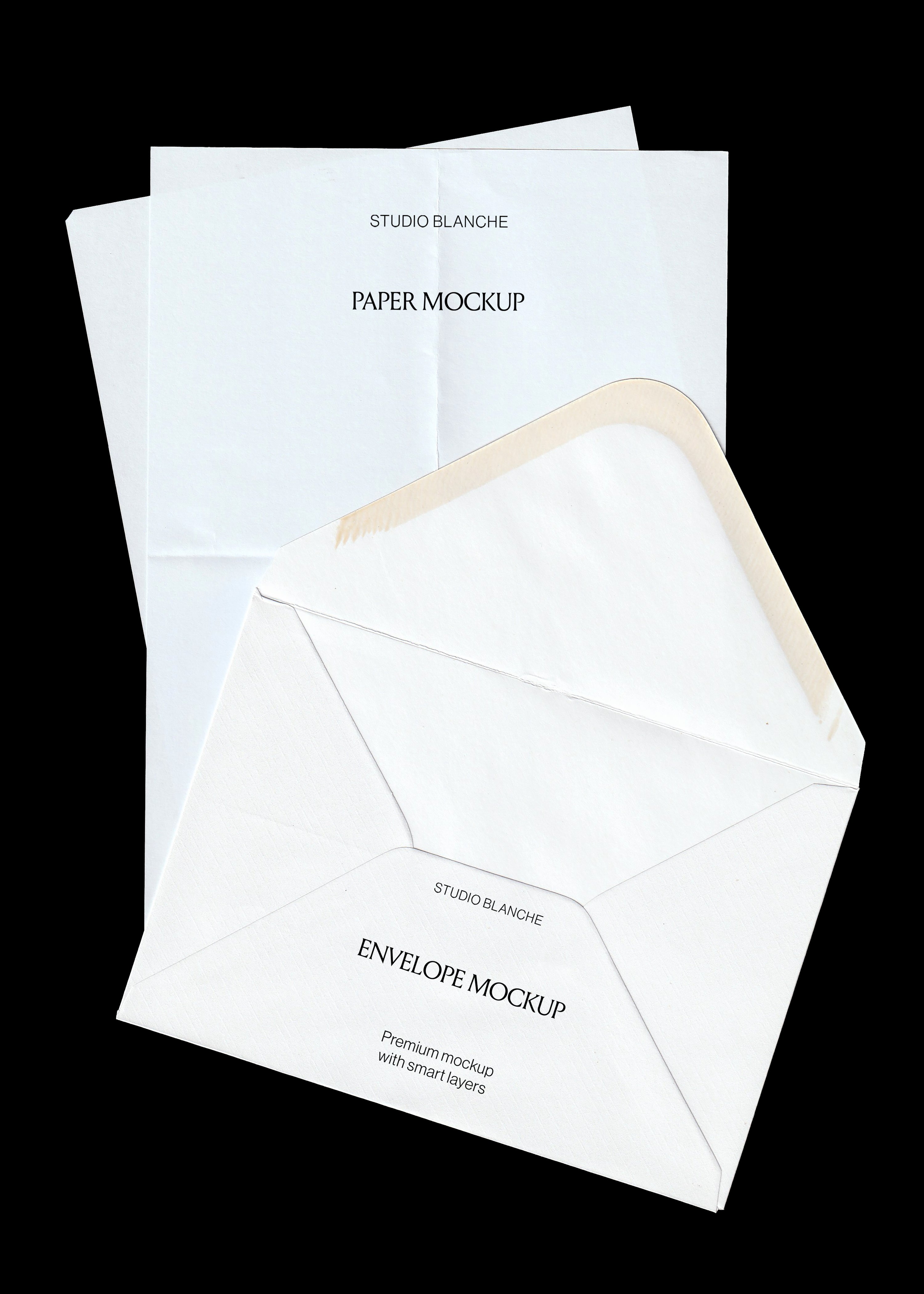 Scanned stationery mockup, white envelope with open flap layered over a creased folded A4 sheet on black