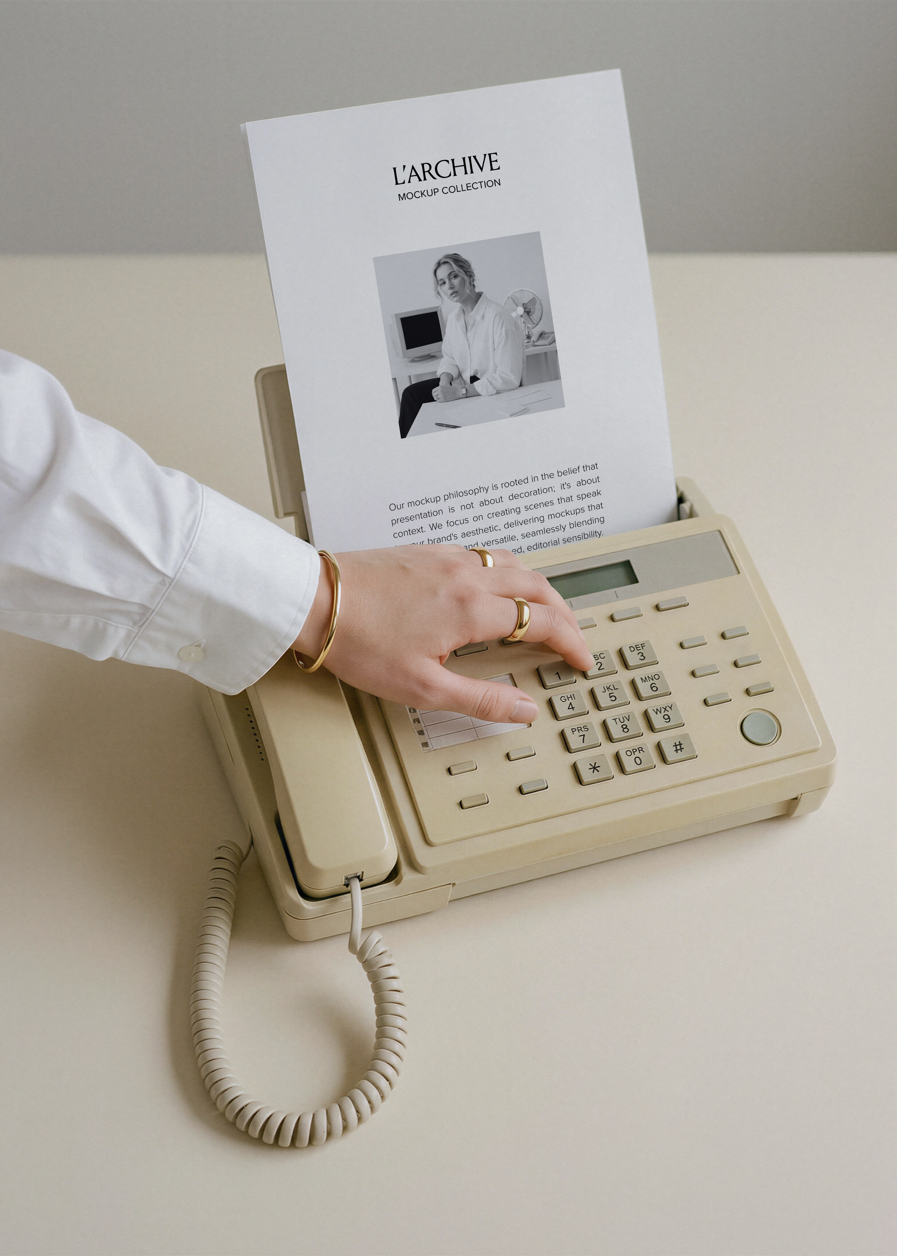 A4 card stationery mockup feeding through cream vintage fax machine, hand dialling keypad with gold rings and bangle