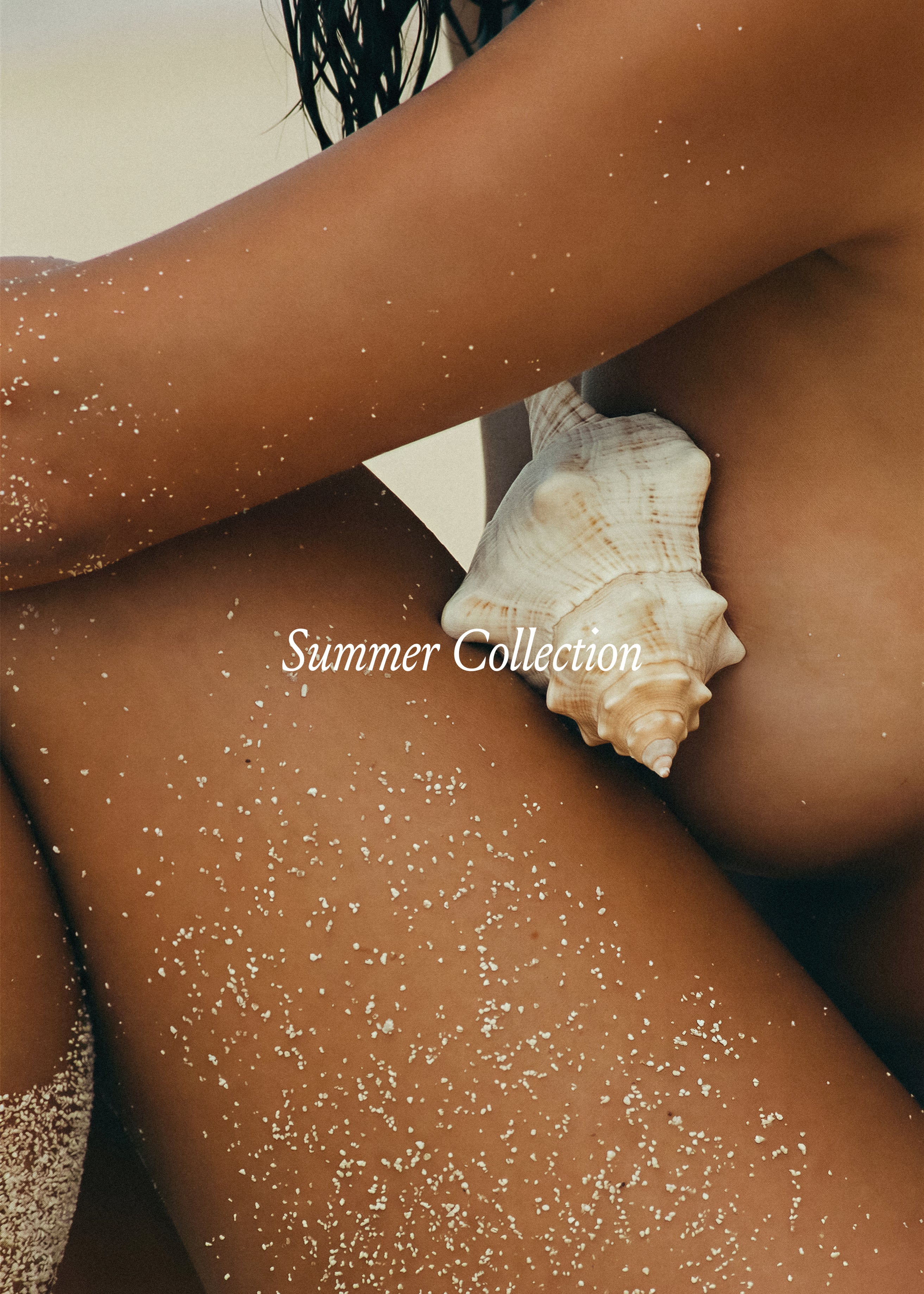 Sand-dusted skin and conch shell, close crop, warm brown tones. Summer Collection Vol. III, Studio Blanche.