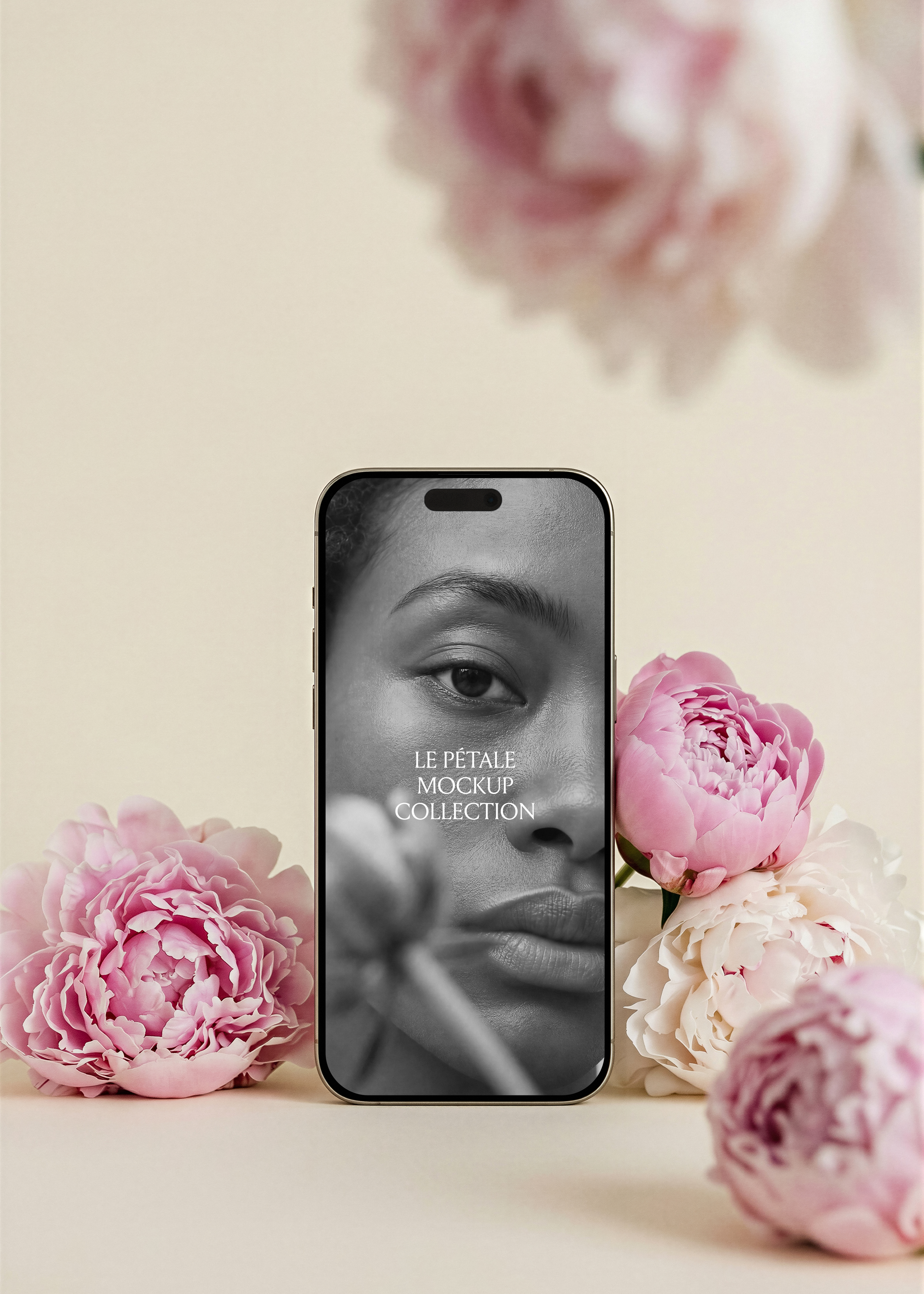 Gold iPhone mockup with campaign screen, pink peonies left and right base, blurred peony bloom overhead, warm sand backdrop