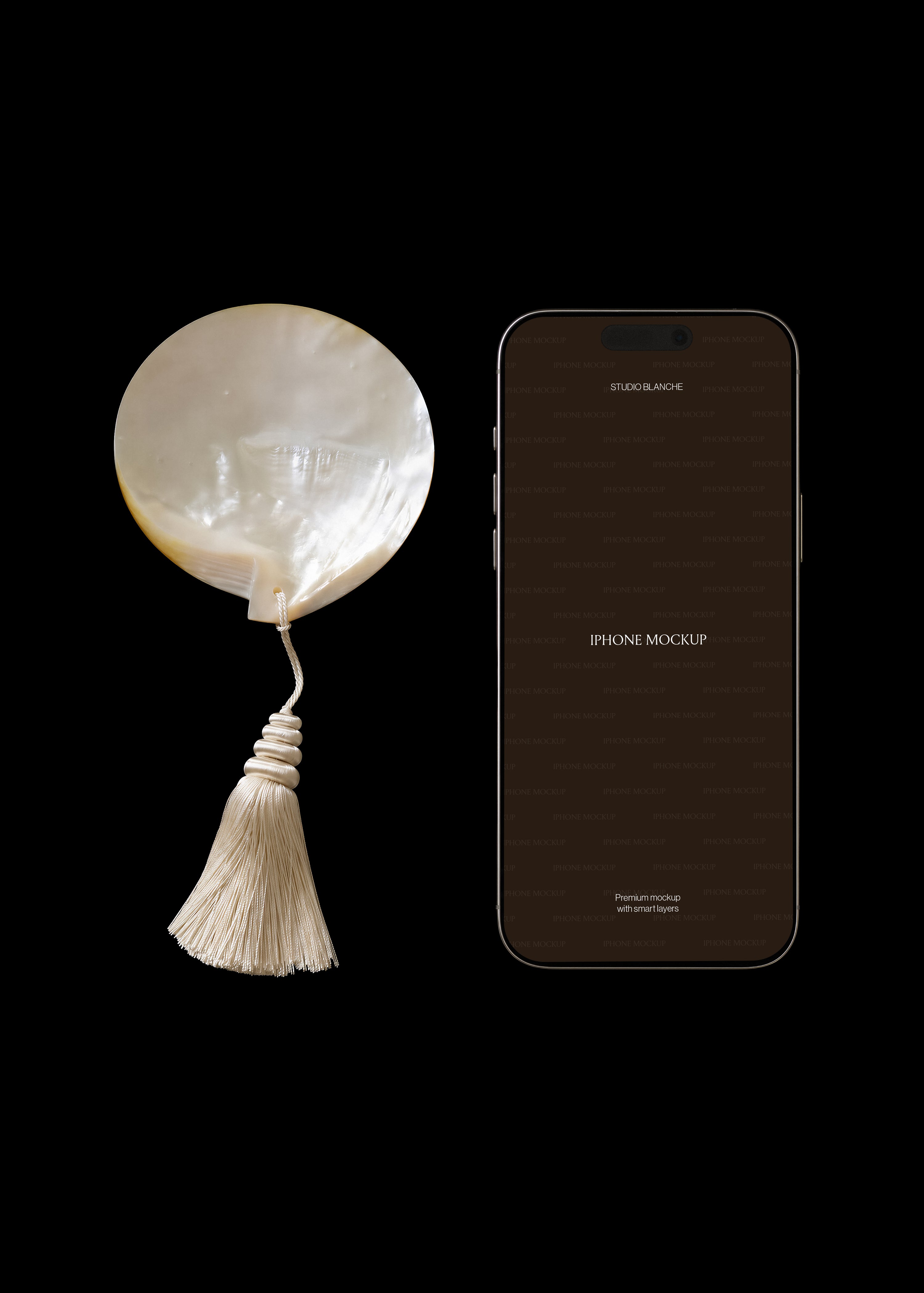 iPhone mockup with dark editable screen beside iridescent pearl shell and cream tassel on black editorial scene