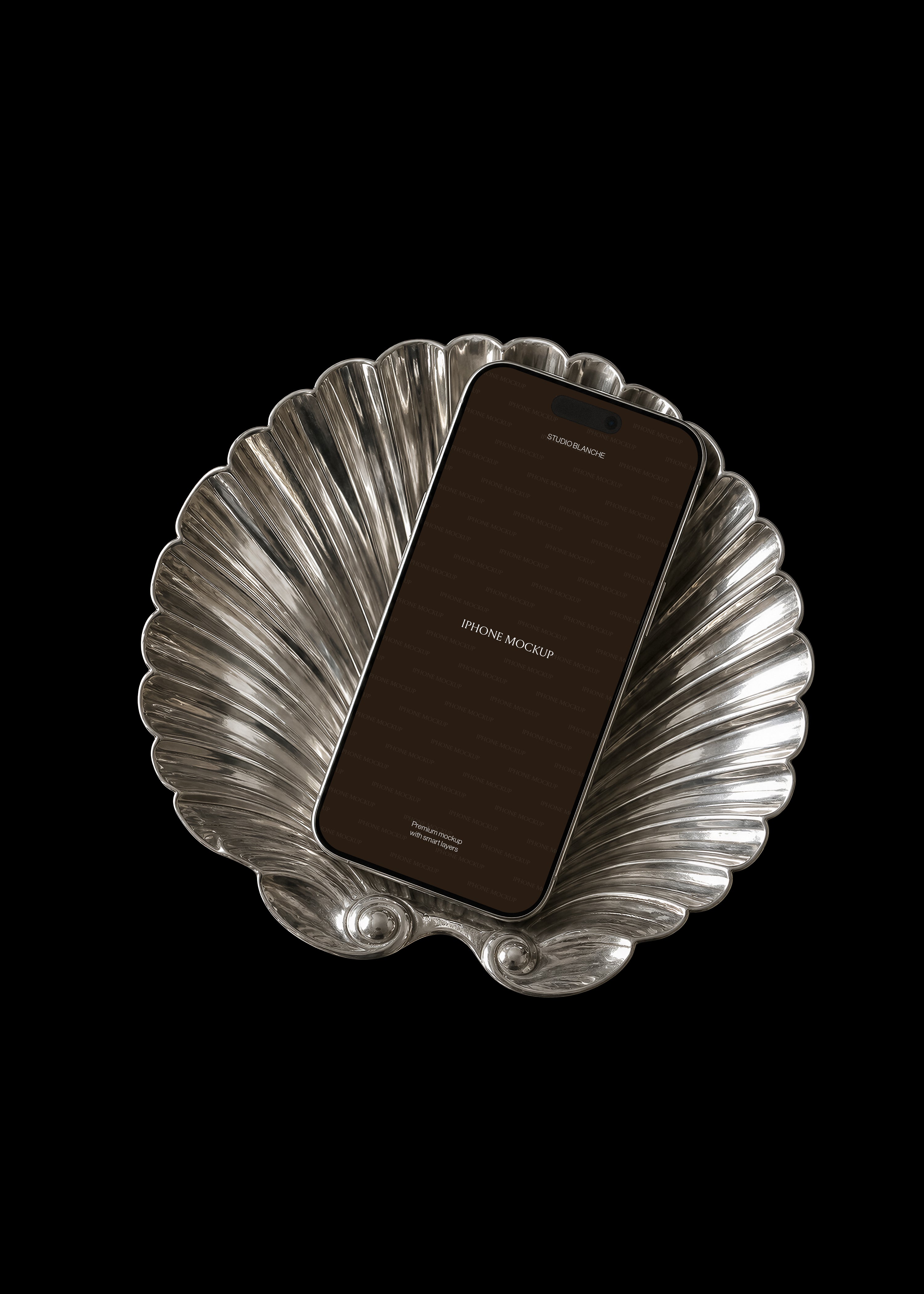 iPhone mockup with dark editable screen on polished silver shell tray, diagonal layout, dark editorial styling