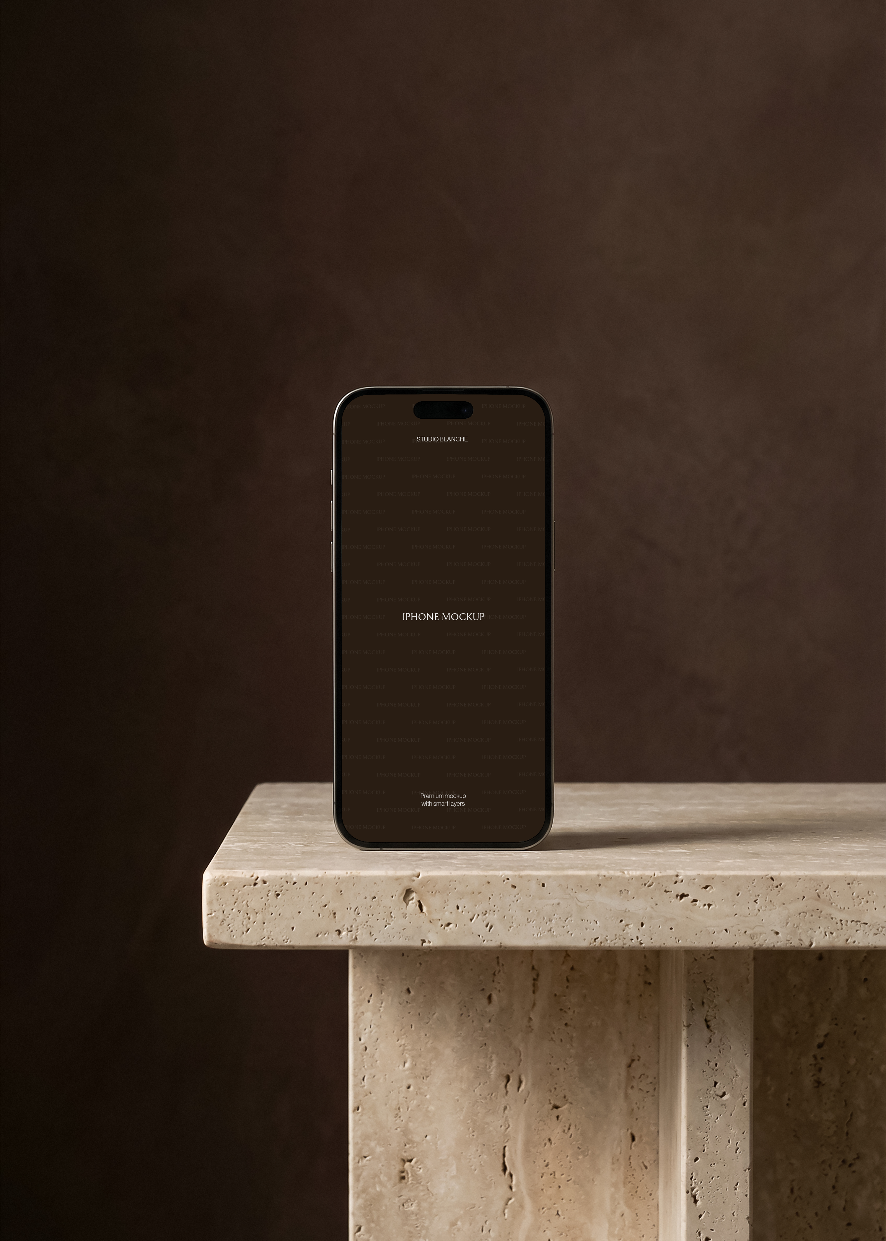 iPhone mockup upright on sandstone plinth with dark brown backdrop, screen showing minimal Studio Blanche branding